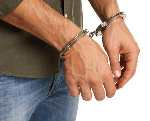 Man in metal handcuffs on white background, closeup