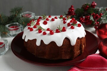 Traditional classic Christmas cake and decor on white table, closeup