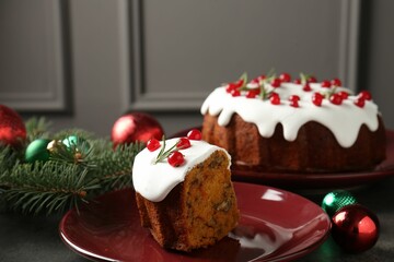Traditional classic Christmas cake and decor on gray textured table