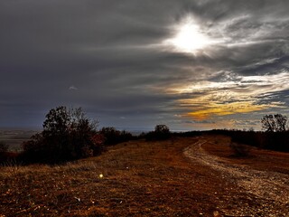 Obraz premium sunset on the road in the mountain