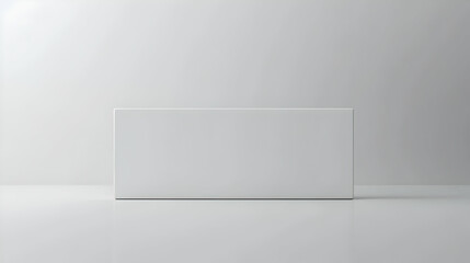 A blank, white rectangular box sits on a white surface against a white background.