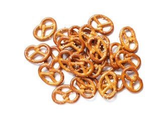 Many delicious pretzel crackers isolated on white, top view
