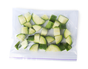 Frozen chopped zucchini in plastic bag isolated on white, top view
