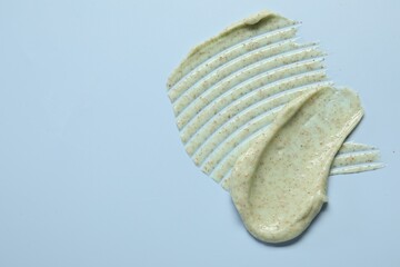 Sample of body scrub on light background, top view. Space for text