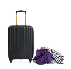 Black suitcase and messy pile of clothes isolated on white