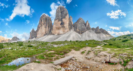 Tre Cime di Lavaredo reflecting in mountain lake, Dolomites, Italy