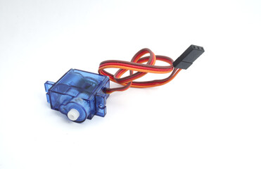 A blue plastic micro servo on a white background. Used by electronics, mechatronics, robotics, and remote control hobbyists.