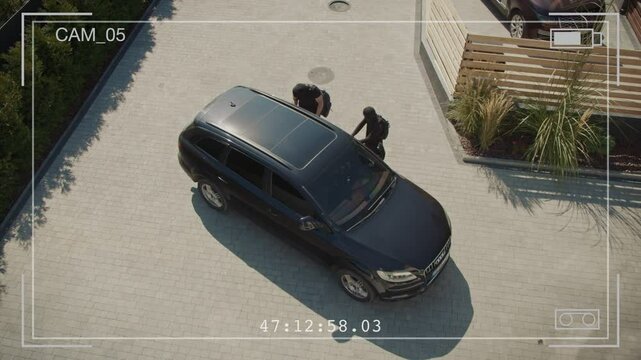 Security Footage. Two Burglars Try to Break Into a Parked Car, but Are Frightened Away by a Guard Dog on Duty. Dogs in Preventing Car Theft and Enhancing Security in Parking Areas and Private Property
