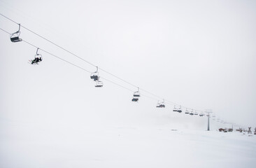 Chairlift in white fog