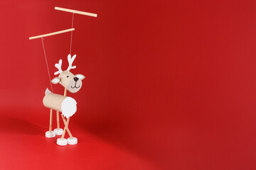 DIY toilet paper roll craft for kids featuring homemade reindeer marionette toy from recycled...