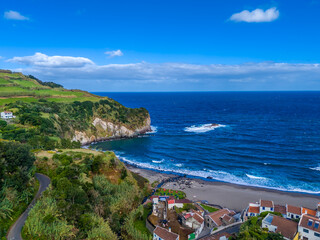 Praia dos Moinhos. Aerial drone view of volcanic black sand beach in Moinhos town, Sao Miguel, Azores, Portugal. Atlantic ocean coast