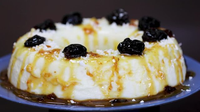 Traditional Brazilian coconut flan dessert known as manjar branco, manjar de coco and manjar dos deuses. Served with plum syrup.