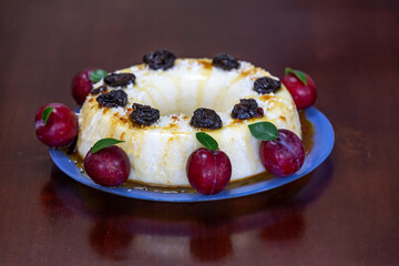 Traditional Brazilian coconut flan dessert known as manjar branco, manjar de coco and manjar dos deuses. Served with plum syrup.