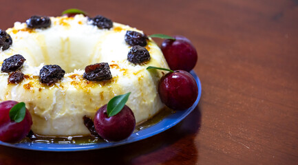 Traditional Brazilian coconut flan dessert known as manjar branco, manjar de coco and manjar dos deuses. Served with plum syrup.