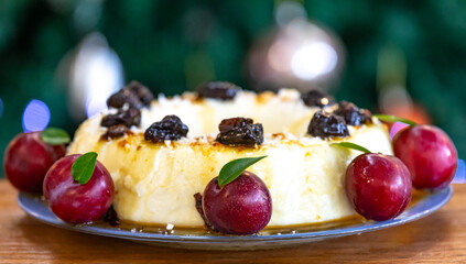 Traditional Brazilian coconut flan dessert known as manjar branco, manjar de coco and manjar dos deuses. Served with plum syrup.