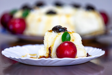 Traditional Brazilian coconut flan dessert known as manjar branco, manjar de coco and manjar dos deuses. Served with plum syrup.