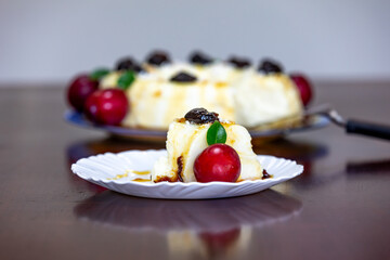Traditional Brazilian coconut flan dessert known as manjar branco, manjar de coco and manjar dos deuses. Served with plum syrup.