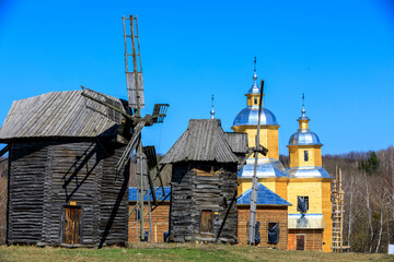 Eastern Europe,Ukraine, Kiev, Kyiv. Pyrohiv, also Pirogov,  a village south of Kiev, the capital city. Now home to an outdoor Museum of Folk Architecture and Life of Ukraine. Wooden Windmills.