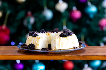 Traditional Brazilian coconut flan dessert known as manjar branco, manjar de coco and manjar dos deuses. Served with plum syrup.