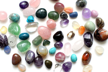 Multicolored healing chakra crystals. Real semi-precious stones: amethyst, rose quartz, agate, turquoise, citrine, apatite.