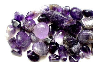 Multicolored healing chakra crystals. Real semi-precious stones of purple amethyst. Natural mineral quartz.