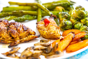 Real, strong, healthy, nutritious food, grilled chicken, pimenta biquinho, asparagus, mushrooms, Brussels sprouts and carrots.