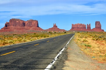 Monument Valley is a region of the Colorado Plateau characterized by a cluster of vast sandstone buttes above the valley floor. It is located on the Arizona-Utah state line, USA