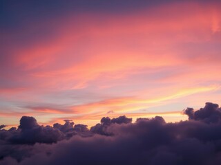 Fototapeta premium Scenic view of fluffy clouds in vibrant colors against a bright sunset sky, beautiful, evening