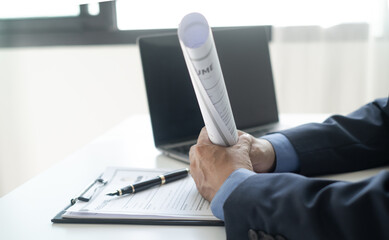 Executive CEO businessman checking job applicant documents resumes, interviews, and signing to approve the contract in the office room