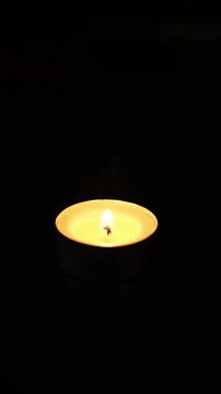 A candle on a black background,4k