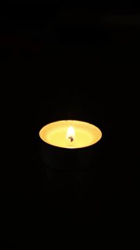 A candle on a black background,4k