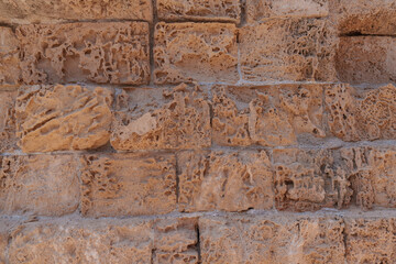 Fototapeta premium Old brick-shaped stone wall