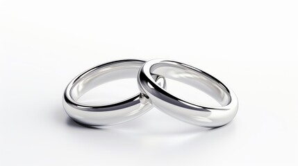 Two perfect circles, representing rings, positioned against a white background for a subtle, refined visual effect. 