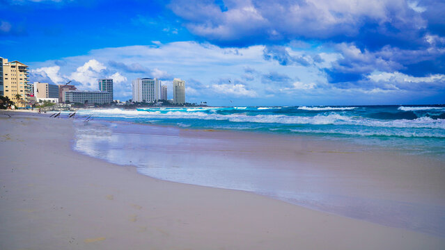 Scenic view of the aquamarine blue waters of the Caribbean sea on Playa Chacmool beach with hotel buildings in downtown Cancun,in the prime Hotel Zone,Cancun,Quintana Roo,Mexico 