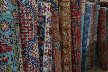An exhibition of rolled up carpets, ready for sale