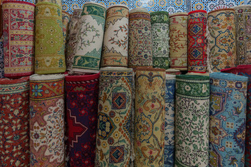 An exhibition of rolled up carpets, ready for sale