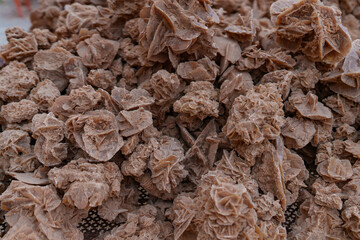 The rock, the desert rose, arranged in great heaps