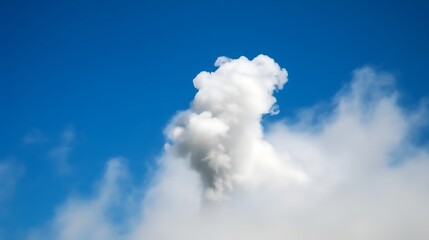 Single Puffy White Cloud Against Blue Sky