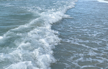 Espuma de olas en la playa