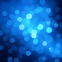 blurry Blue bokeh lights against black background in aerial view