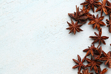 Composition with aromatic star anise on light background