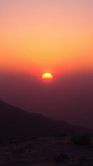 Obraz premium Soft orange hues fade into a gradient of purple shades at the horizon, abstract sunset watercolor background, gentle colors, natural beauty