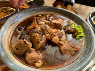 Buk Kut Teh, a Chinese pork soup dish, eat with rice and some vegetable, normally found in Malaysia and Singapore