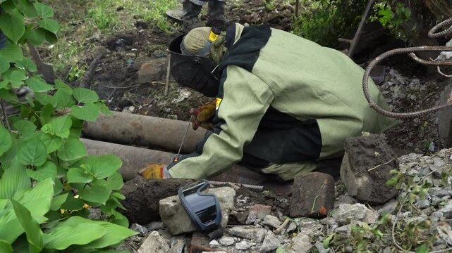 August 13, 2020 - Artem, Russia - Heating main repair. Workers are repairing the heating main.