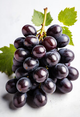 Fototapeta premium Fresh Bunch of Black Grapes Isolated on a White Background.