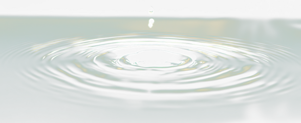 Water droplet impact creating concentric ripples on a dark teal surface.