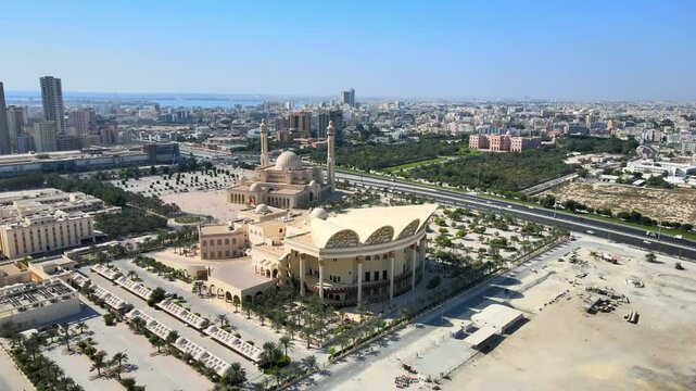 Camera drone orbiting above the Isa Cultural Centre, Al Fateh Grand Mosque, and Al-Qudaibiya Palace, Manama, Bahrain