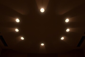 Nine Spotlights on Ceiling Nine spotlights in a nonagonal arrang