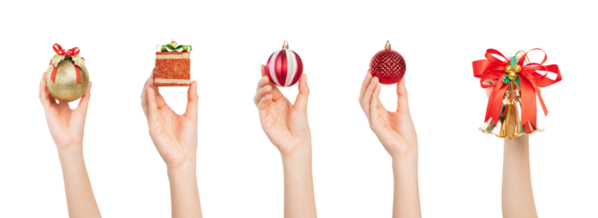 Hand holding Christmas ball decoration, gift box on isolated white background.