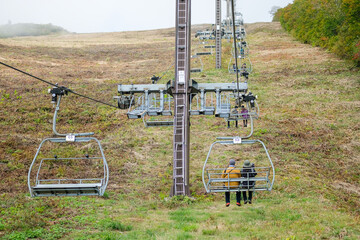 Happo Alpen Line Nature trail, Hakuba, Nahano, Japan, chairlift in foggy landscape